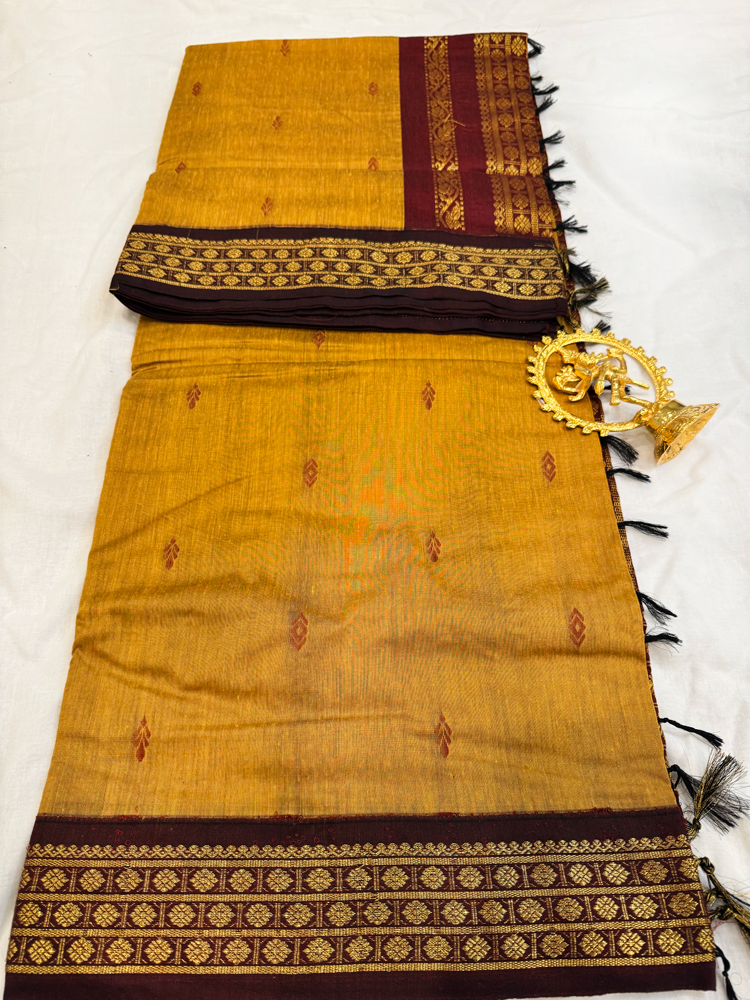 Ocher yellow Kalyani silk cotton saree with maroon pallu and traditional border