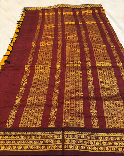 Ocher yellow Kalyani silk cotton saree with maroon pallu and traditional border
