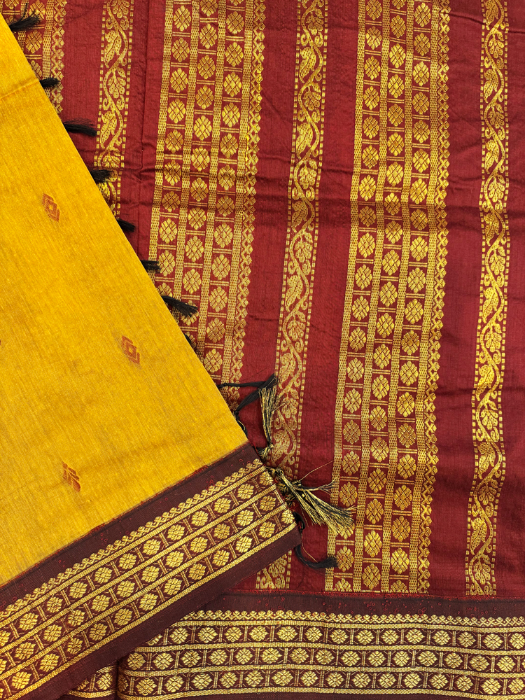 Ocher yellow Kalyani silk cotton saree with maroon pallu and traditional border