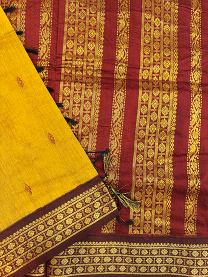 Ocher yellow Kalyani silk cotton saree with maroon pallu and traditional border