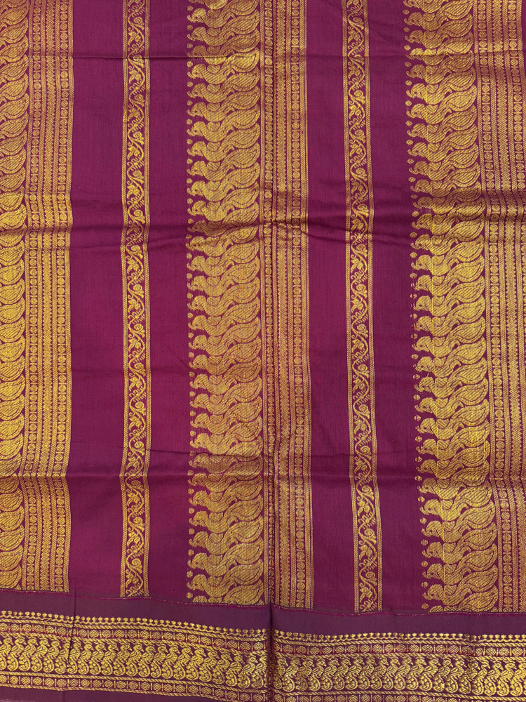 Slate blue kalyani silk cotton saree with dark purple pallu and golden peacock border