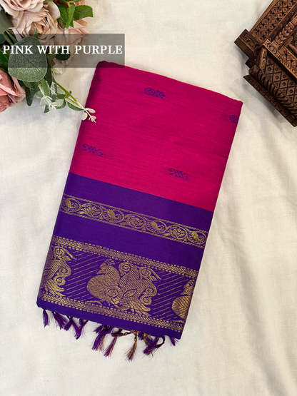 Magenta kalyani silk cotton saree with gold peacock patterns on a white background