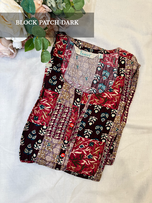 Multi color kurti with patch work patterns on a light background
