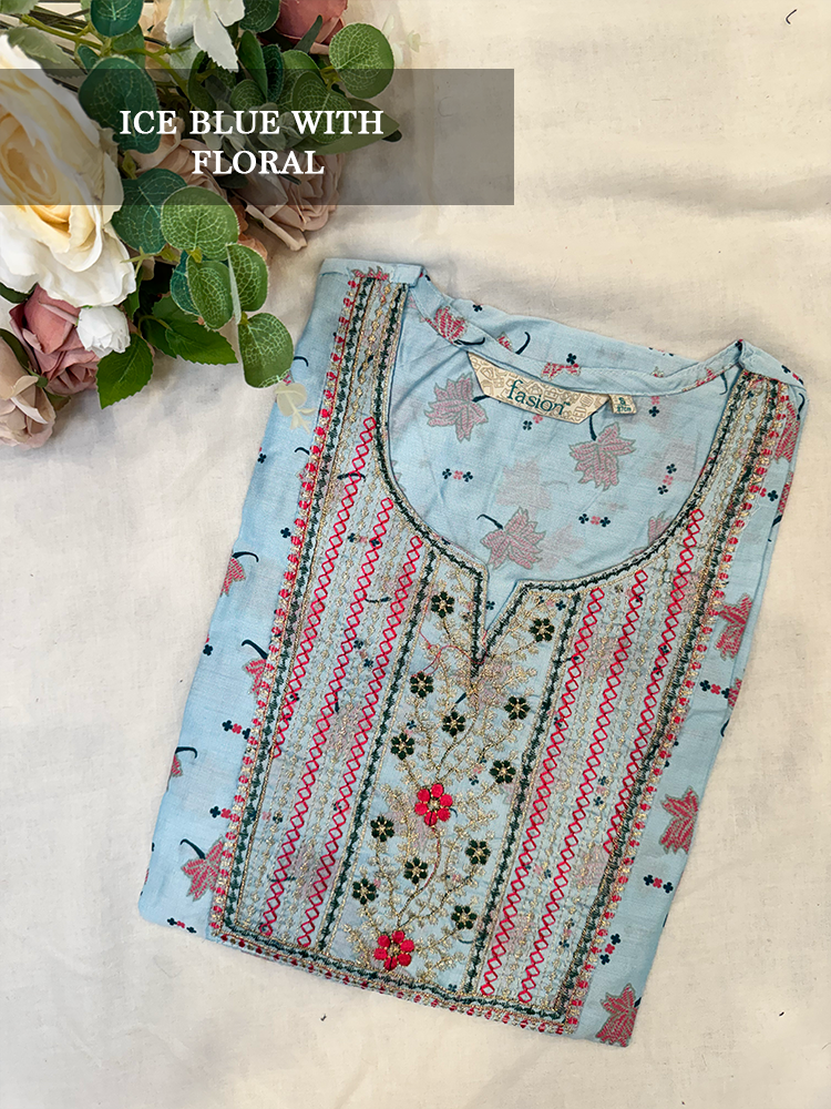 Ice blue embroidered kurti with floral patterns on a light background