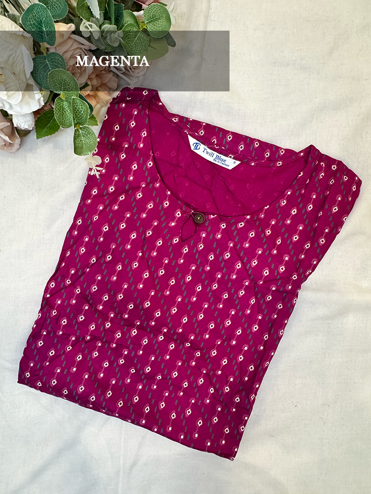 Magenta kurti with white floral pattern on a light background