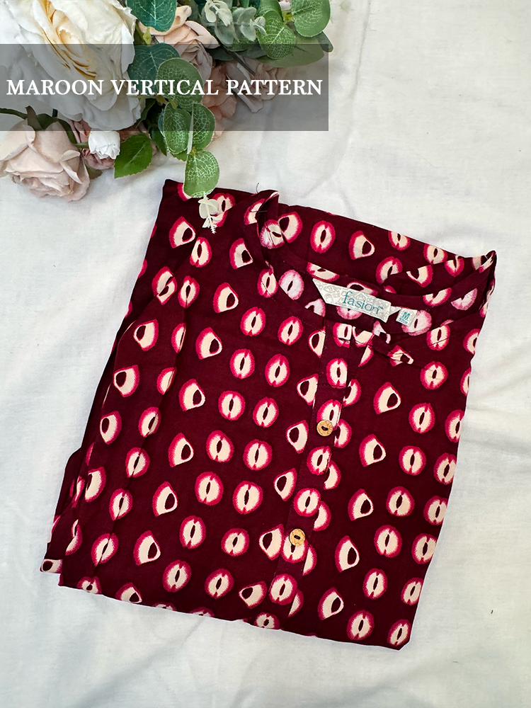 Maroon rayon kurti  with vertical pattern on a white surface with flowers.