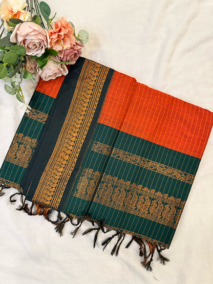 Kalyani silk cotton saree in orange checked pattern and green border. 