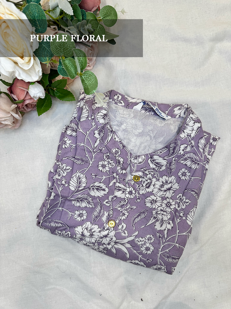  Purple floral Kurti on a light background with flowers in the corner.