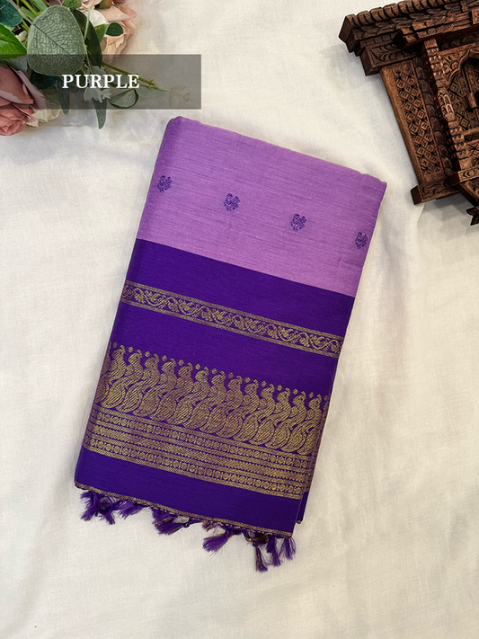Purple kalyani silk cotton saree with gold patterns on a white background