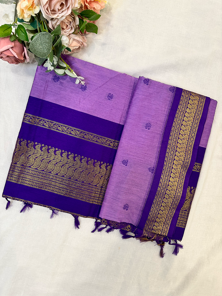 Purple kalyani silk cotton saree with gold patterns on a white background