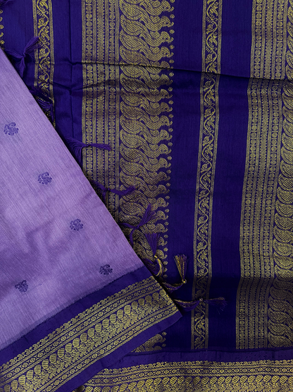 Purple kalyani silk cotton saree with gold patterns on a white background