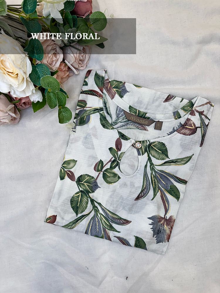 Floral-patterned kurti on a light background with flowers.